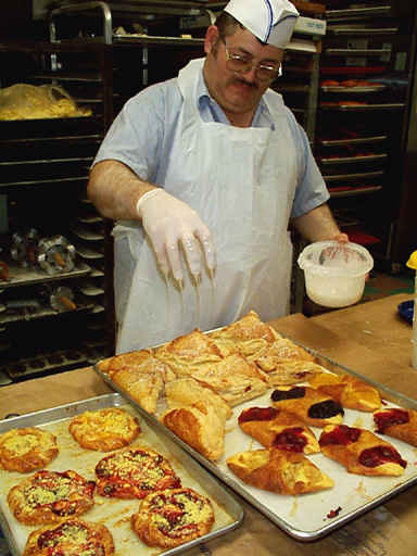 Rick Betts glazing apple turnovers