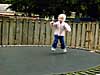 Kaylie jumps on the trampoline